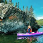 MJ Hendren pictured kayaking at Hidden Lake next to a large rock exposure. (Photo provided)