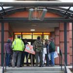 Demonstrators gather outside of Soldotna City Hall to protest COVID-19 mandates on Wednesday, Oct. 13, 2021 in Soldotna, Alaska. (Ashlyn OHara/Peninsula Clarion)