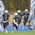 Brock Wilson and Brayden Taylor lead Soldotna onto Justin Maile Field for a Division II semifinal against North Pole on Friday, Oct. 8, 2021, in Soldotna, Alaska. (Photo by Jeff Helminiak/Peninsula Clarion)