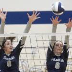 Soldotnas Adarra Hagelund and Chloe Armstrong put up a block against Nikiski on Thursday, Oct. 14, 2021, at Soldotna High School in Soldotna, Alaska. (Photo by Jeff Helminiak/Peninsula Clarion)