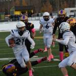 Soldotna junior Brayden Taylor rushes the ball down the field during the Division II state football championship game against Lathrop at Service High School in Anchorage on Saturday, Oct. 16, 2021. (Camille Botello/Peninsula Clarion)