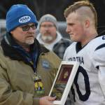 Soldotna senior Dylan Dahlgren accepts the teams academic award after the Division II state football championship game against Lathrop at Service High School in Anchorage on Saturday, Oct. 16, 2021.(Camille Botello/Peninsula Clarion)