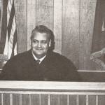 Photo from Once Upon the Kenai 
Kenai magistrate Jess Nicholas poses at his bench in this circa 1970 image.