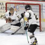 Kenai River Brown Bears goaltender Tommy Aitken makes a save against the Chippewa (Wisconsin) Steel on Friday, Oct. 21, 2021, at the Soldotna Regional Sports Complex in Soldotna, Alaska. (Photo by Jeff Helminiak/Peninsula Clarion)