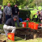 In this Sept. 3, 2014, file photo, workers and medical examiner crew members exhume the body of Jane Doe #3 from a cemetery in Anchorage, Alaska. The remains of a woman known for 37 years only as Horseshoe Harriet, one of 17 victims of a notorious Alaska serial killer, have been identified through DNA profiling as Robin Pelkey, authorities said Friday, Oct. 22, 2021. (AP Photo/Rachel DOro, File)