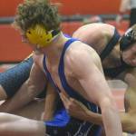 Soldotna's Hunter Richardson and Homer's Nestor Kalugin tangle at 189A at the Luke Spruill Memorial Tournament on Saturday, Oct. 23, 2021, at Kenai Central High School in Kenai, Alaska. Richardson won the match 11-1 on the way to first place, while Kalugin was third. (Photo by Jeff Helminiak/Peninsula Clarion)