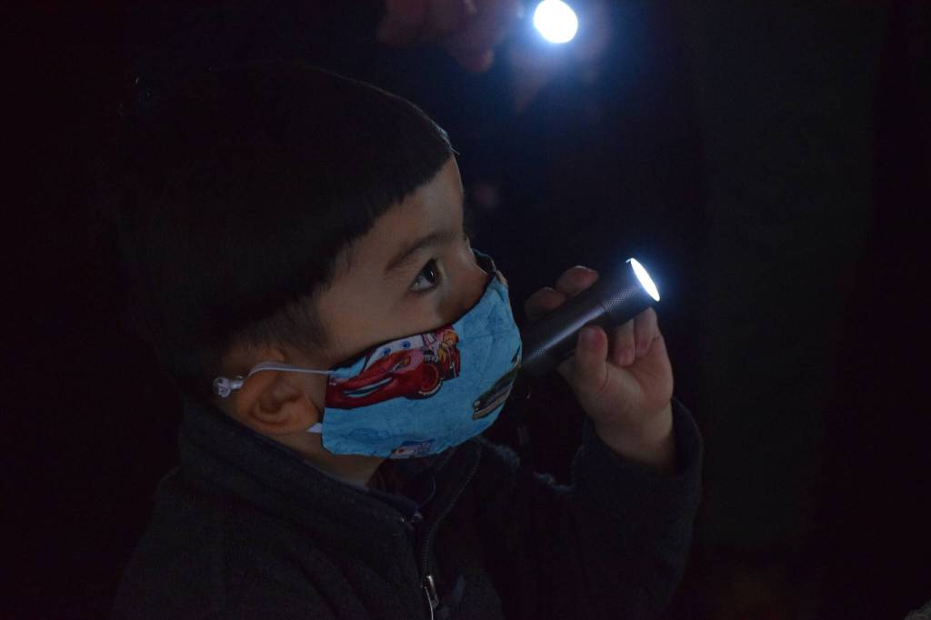 Hunter Phillips walks through the Kenai Community Library Haunted Hunt on Tuesday, Oct. 26, 2021. (Camille Botello/Peninsula Clarion)