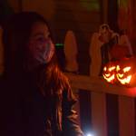 Heather Phillips walks through the Kenai Community Library Haunted Hunt on Tuesday, Oct. 26, 2021. (Camille Botello/Peninsula Clarion)