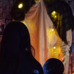 Heather and Hunter Phillips walk through the Kenai Community Library Haunted Hunt on Tuesday, Oct. 26, 2021. (Camille Botello/Peninsula Clarion)