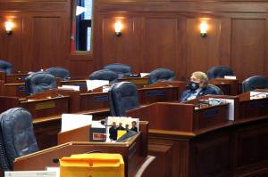 Alaska state Rep. Laddie Shaw, an Anchorage Republican, waits for the start of a so-called technical session on the House floor, Wednesday, Oct. 20, 2021, in Juneau, Alaska. The fourth special legislative session of the year began Oct. 4, in Juneau, but there has been little action at the Capitol and little progress toward resolving Alaskas fiscal issues. (AP Photo/Becky Bohrer)