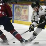Love Bergvall of the Fairbanks Ice Dogs and Max Marquette of the Kenai River Brown Bears battle for the puck Friday, Oct. 29, 2021, at the Soldotna Regional Sports Complex in Soldotna, Alaska. (Photo by Jeff Helminiak/Peninsula Clarion)
