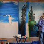 Melinda Hershberger works on her installation for the Kenai Art Centers collaborative mural project on Wednesday, Nov. 3, 2021. (Camille Botello/Peninsula Clarion)