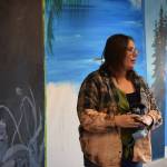Abbey Ulen works on her installation for the Kenai Art Centers collaborative mural project on Wednesday, Nov. 3, 2021. (Camille Botello/Peninsula Clarion)