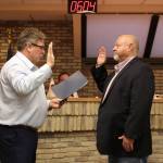 Kenai Mayor Brian Gabriel (left) swears in Kenai City Council member James Baisden during a meeting of the Kenai City Council on Wednedsay, Nov. 3, 2021 in Kenai, Alaska. (Ashlyn OHara/Peninsula Clarion)