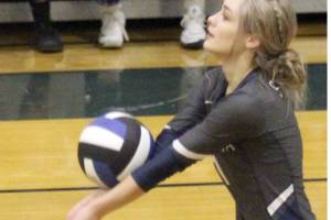 Soldotna's Jolie Wildaman receives a serve during the first day of the Northern Lights Conference Championships on Thursday at Palmer High School. (Photo by Jeremiah Bartz/Frontiersman)