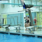 Soldotnas Abriella Werner competes in the state diving finals at Bartlett High School in Anchorage on Saturday, Nov. 6, 2021. (Camille Botello/Peninsula Clarion)