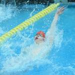 Kenais Samuel Anderson competes in the state swimming finals at Bartlett High School in Anchorage on Saturday, Nov. 6, 2021. (Camille Botello/Peninsula Clarion)