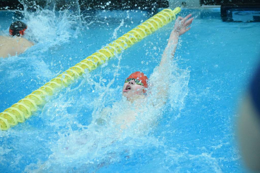 Kenais Samuel Anderson competes in the state swimming finals at Bartlett High School in Anchorage on Saturday, Nov. 6, 2021. (Camille Botello/Peninsula Clarion)