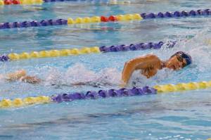 Homer's Jillian Crooks competes in the state swimming finals at Bartlett High School in Anchorage on Saturday, Nov. 6, 2021. (Camille Botello/Peninsula Clarion)