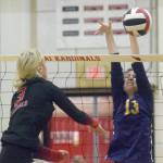 Kenai Centrals Cali Holmes attacks Homers Goldie Hill on Thursday, Sept. 30, 2021, at Kenai Central High School in Kenai, Alaska. (Photo by Jeff Helminiak/Peninsula Clarion)