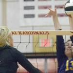 Kenai Central's Cali Holmes attacks Homer's Goldie Hill on Thursday, Sept. 30, 2021, at Kenai Central High School in Kenai, Alaska. (Photo by Jeff Helminiak/Peninsula Clarion)