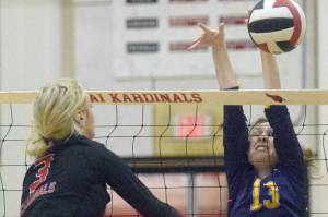Kenai Central's Cali Holmes attacks Homer's Goldie Hill on Thursday, Sept. 30, 2021, at Kenai Central High School in Kenai, Alaska. (Photo by Jeff Helminiak/Peninsula Clarion)