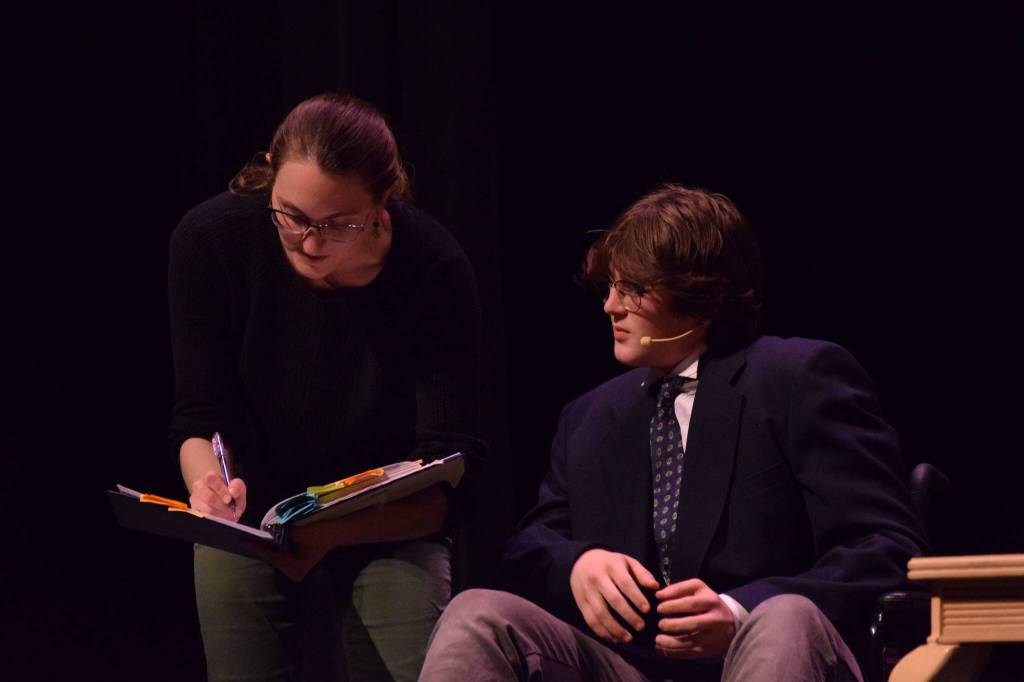 Sara Erfurth, left, gives stage direction during the rehearsals for Soldotna High Schools production of Annie on Tuesday, Nov. 9, 2021. (Camille Botello/Peninsula Clarion)