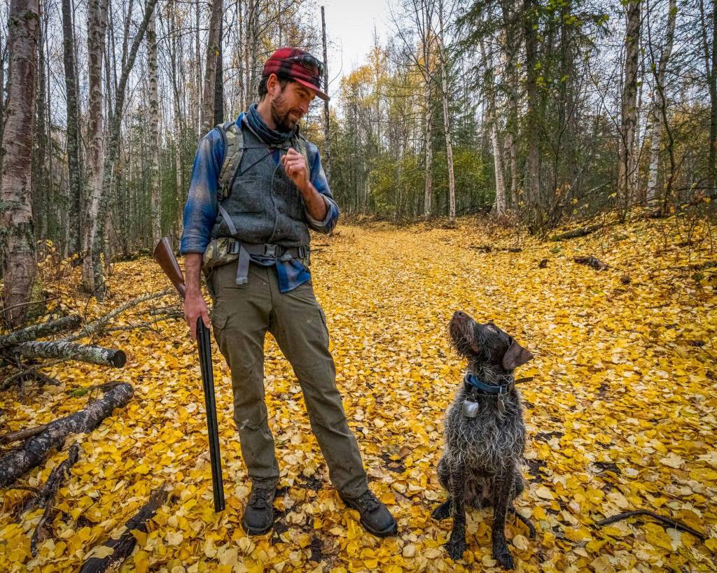 Fall colors, a dog and game in hand make for great outdoor experiences on the Kenai National Wildlife Refuge. (Photo by Colin Canterbury/USFWS)
