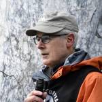 Veterans for Peace Juneau chapter president Craig Wilson, a U.S. Coast Guard veteran, speaks to a small crowd in front of the Alaska State Capitol on Nov. 11, 2021, which the group recognizes as Armistice Day to remember all the lives lost to war and advocate for world peace. (Peter Segall / Juneau Empire)