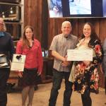 Delana Green, second from right, poses Friday with judges during the Spark Soldotna event at the Lone Moose Lodge. From left: Steve Horn, retired Kenai Peninsula College Associate Professor of Business; Jenny Neyman, KDLL general manager; Tim Jordan, of Northern Tech Group; Delana Green, winner; and Kenai Peninsula Borough Assembly member Tyson Cox.