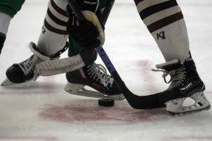 Kenai Central’s Ayden Spann skates the puck across the blue line during a 4-1 loss to Colony during the second day of the 2021 Alaska Army National Guard Stars and Stripes Showdown on Friday, Nov.12, 2021, at the MTA Events Center in Palmer, Alaska. (Photo by Jeremiah Bartz/Frontiersman)