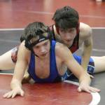 Kenai Centrals Talon Whicker wrestles to a pin of Soldotnas Ryan Buchanan at 125 pounds during a dual meet at Kenai Central High School on Tuesday, Nov. 16, 2021, in Kenai, Alaska. (Photo by Jeff Helminiak/Peninsula Clarion)