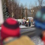 Members of the Many Voices advocacy group gather outside of Central Peninsula Hospital in Soldotna to demonstrate their support for healthcare staff on Saturday, Nov. 20, 2021. Folks protesting COVID-19 vaccine mandates and advocating for alternative treatments stand down the block behind them. (Camille Botello/Peninsula Clarion)