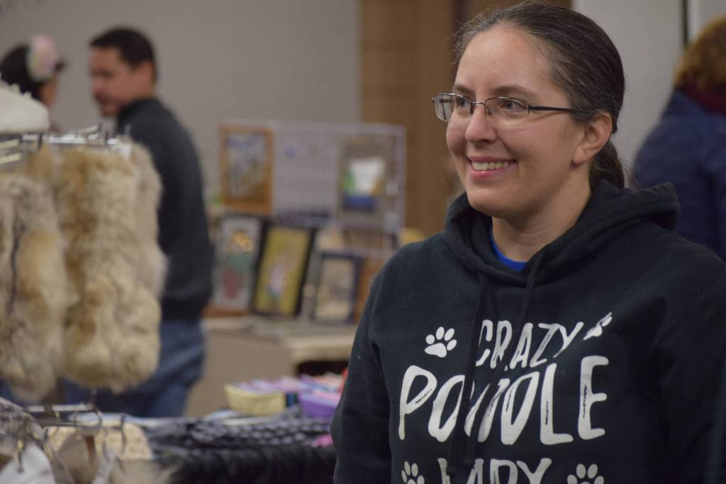 Amanda Alaniz sells fur products at the Soldotna Holiday Bazaar at the Soldotna Regional Sports Complex on Saturday, Nov. 20, 2021. (Camille Botello/Peninsula Clarion)