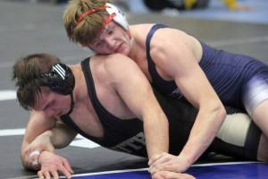 Soldotna junior Liam Babitt holds a grip on South Anchorage’s Britten Hamilton during the 215-pound final of the Lancer Smith Fall Varsity 2021 Invite on Saturday, Nov. 20, 2021 at the Menard Arena in Wasilla, Alaska. (Photo by Jeremiah Bartz/Frontiersman)