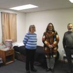 From left: Kathy Gensel, president of Bridges Community Resource Network, Inc.; Love INC Executive Director Leslie Rohr; and Tim Navarre, president of the Kenai Peninsula Foundation, stand in a bedroom at a cold weather shelter set to open next month on Monday, Nov. 22, 2021 in Nikiski, Alaska. (Ashlyn OHara/Peninsula Clarion)