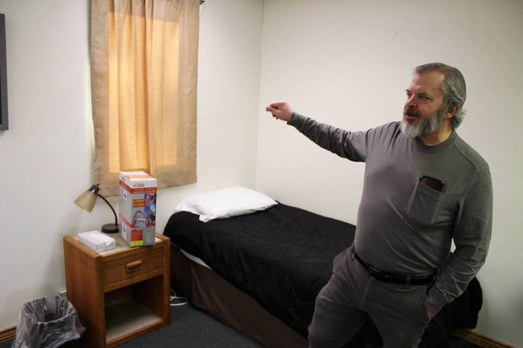 Tim Navarre, president of the Kenai Peninsula Foundation, stands in a bedroom at a cold weather shelter set to open next month on Monday, Nov. 22, 2021 in Nikiski, Alaska. (Ashlyn OHara/Peninsula Clarion)