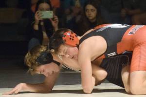 Kenai Central's Sawyer Vann controls Nikiski's Wyatt Maguire at 125 pounds Tuesday, Nov. 23, 2021, at Nikiski High School in Nikiski, Alaska. Vann notched a 7-6 victory. (Photo by Jeff Helminiak/Peninsula Clarion)