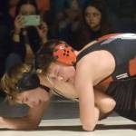 Kenai Centrals Sawyer Vann controls Nikiskis Wyatt Maguire at 125 pounds Tuesday, Nov. 23, 2021, at Nikiski High School in Nikiski, Alaska. Vann notched a 7-6 victory. (Photo by Jeff Helminiak/Peninsula Clarion)