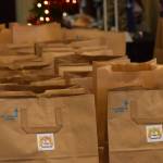 To-go Thanksgiving meals are distributed at the Kenai Senior Center on Tuesday, Nov. 23, 2021. (Camille Botello/Peninsula Clarion)
