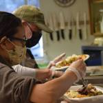 Kay Sturm and Tom Kleeman prepare Thanksgiving lunch at the Kenai Peninsula Food Bank on Wednesday, Nov. 24, 2021. (Camille Botello/Peninsula Clarion)
Kay Sturm and Tom Kleeman prepare Thanksgiving lunch at the Kenai Peninsula Food Bank on Wednesday, Nov. 24, 2021. (Camille Botello/Peninsula Clarion)