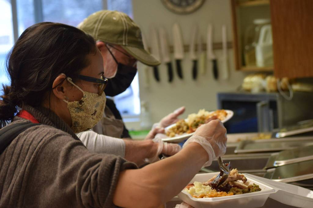 Kay Sturm and Tom Kleeman prepare Thanksgiving lunch at the Kenai Peninsula Food Bank on Wednesday, Nov. 24, 2021. (Camille Botello/Peninsula Clarion)
Kay Sturm and Tom Kleeman prepare Thanksgiving lunch at the Kenai Peninsula Food Bank on Wednesday, Nov. 24, 2021. (Camille Botello/Peninsula Clarion)