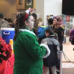 Michelle Walker welcomes families to the Kenai Chamber of Commerce and Visitor Centers Christmas Comes to Kenai event on Friday, Nov. 26, 2021 in Kenai, Alaska. (Ashlyn OHara/Peninsula Clarion)