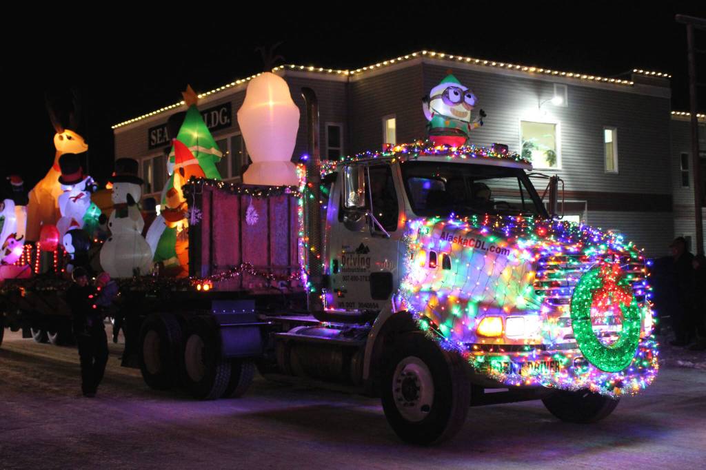 A decorated truck owned by Kenai Peninsula Driving Instruction participates in the Christmas Comes to Kenai parade on Friday, Nov. 26, 2021 in Kenai, Alaska. (Ashlyn OHara/Peninsula Clarion)