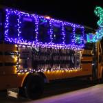 A decorated school bus participates in the Christmas Comes to Kenai parade on Friday, Nov. 26, 2021 in Kenai, Alaska. (Ashlyn OHara/Peninsula Clarion)
