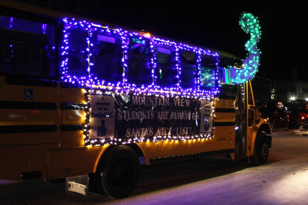 A decorated school bus participates in the Christmas Comes to Kenai parade on Friday, Nov. 26, 2021 in Kenai, Alaska. (Ashlyn OHara/Peninsula Clarion)