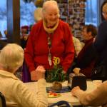 Community members gather for the Kenai Senior Centers 50th anniversary reception on Tuesday, Nov. 30, 2021 in Kenai, Alaska. (Camille Botello/Peninsula Clarion)