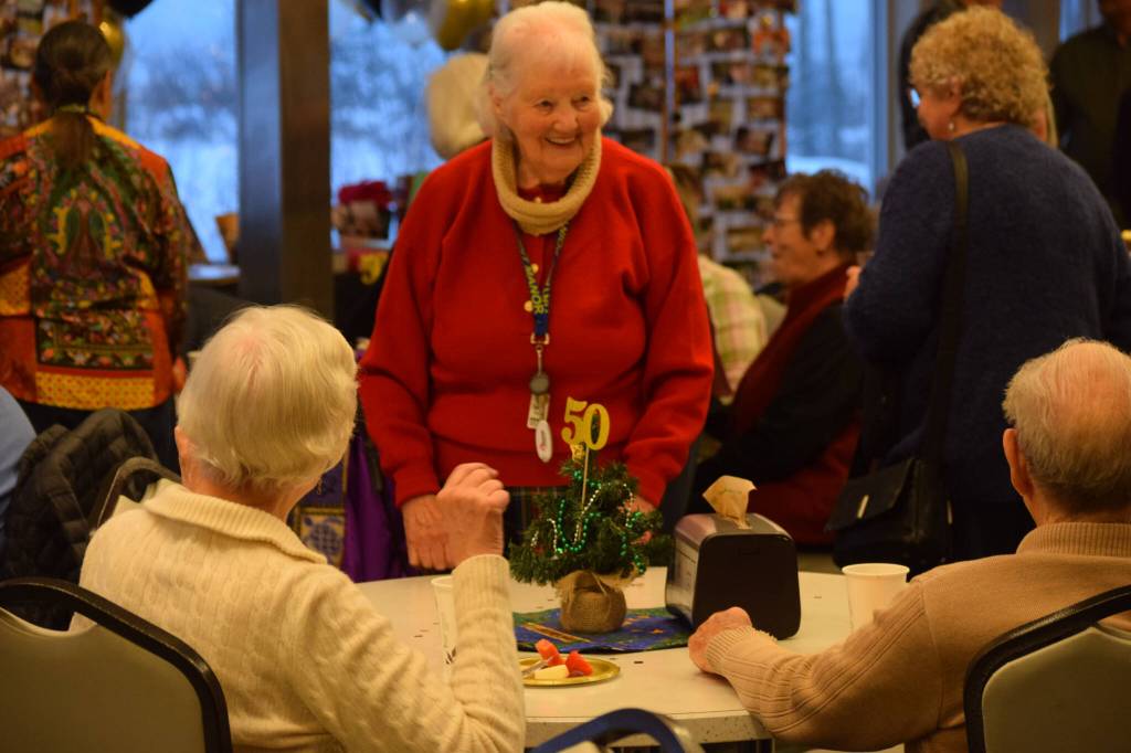Community members gather for the Kenai Senior Centers 50th anniversary reception on Tuesday, Nov. 30, 2021 in Kenai, Alaska. (Camille Botello/Peninsula Clarion)