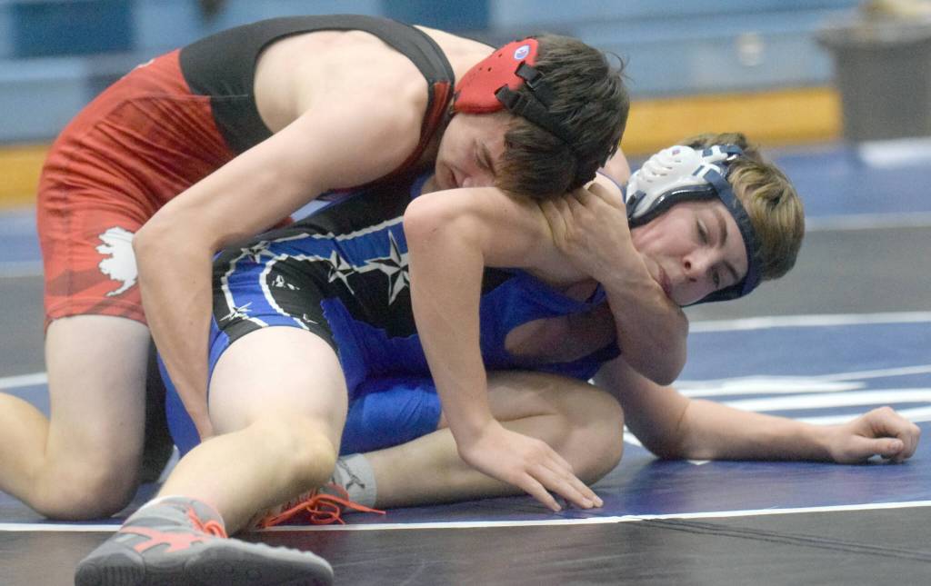 Kenai Centrals Owen Whicker works to a pin of Soldotnas Nicholas Rackley at 130 pounds in a dual meet at Soldotna High School on Tuesday, Nov. 30, 2021, in Soldotna, Alaska. (Photo by Jeff Helminiak/Peninsula Clarion)