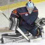 A shot by Kevin Marx Noren of the Kenai River Brown Bears slips past Anchorage Wolverines goalie Raythan Robbins on Friday, Dec. 3, 2021, at the Soldotna Regional Sports Complex in Soldotna, Alaska. (Photo by Jeff Helminiak/Peninsula Clarion)